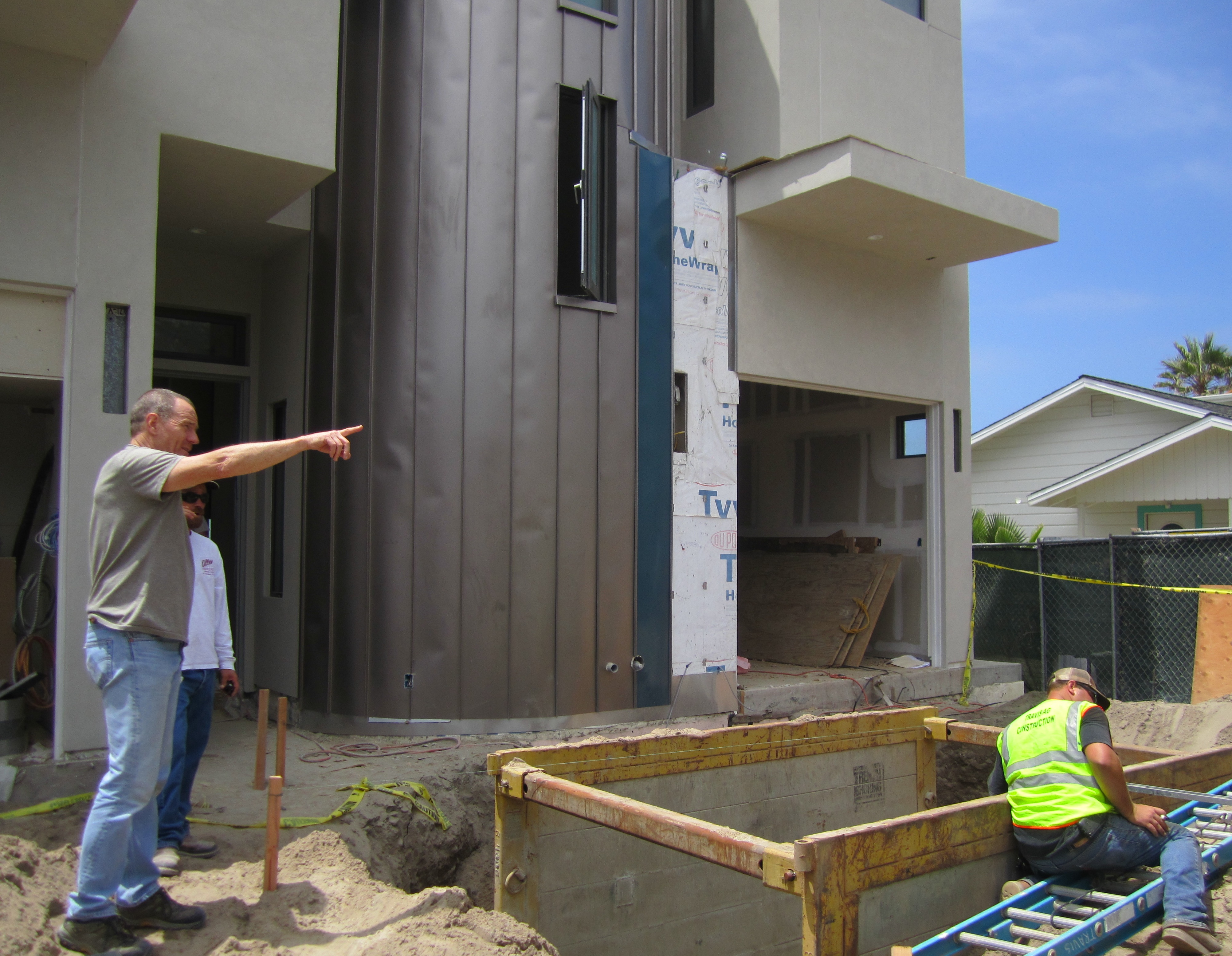 Bryan Cranston pointing out ideas on his LEED home